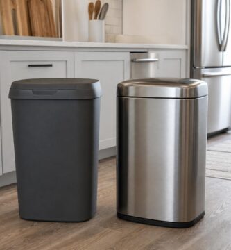 Plastic and stainless steel trash cans side by side