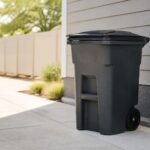 Outdoor trash bin in summer heat with the lid closed