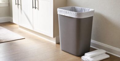 Kitchen trash can with a neatly fitted liner and spare trash bags